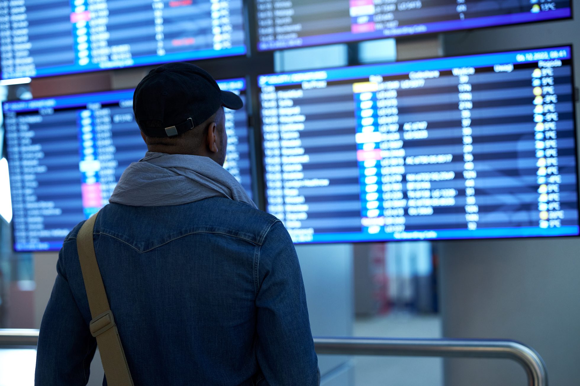 Passenger at the departures board.